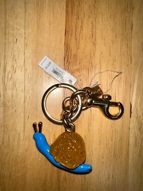 Coach Gold-Tone Keychain with Blue Snail and Amber Charm